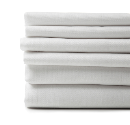 Stack of clean bed sheets on white background