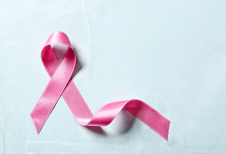 Pink ribbon on light background. Breast cancer awareness concept