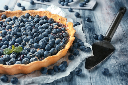 Delicious blueberry pie on wooden tableの写真素材