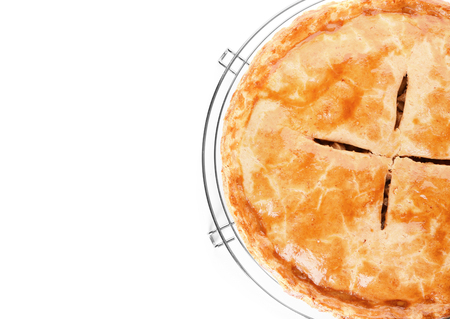 Cooling rack with delicious apple pie on white backgroundの写真素材