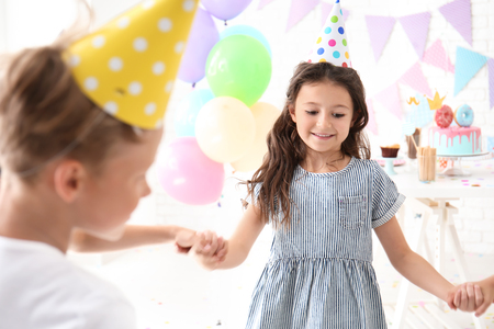 Cute little children celebrating Birthday at homeの写真素材