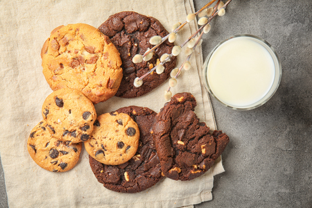 Tasty cookies and glass of milk on grey tableの写真素材