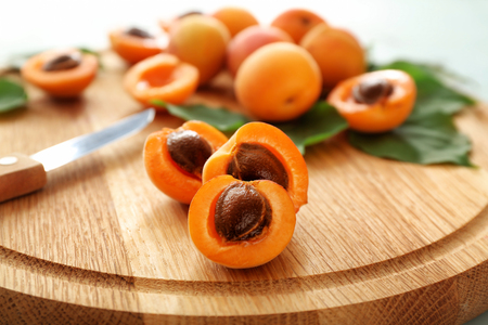 Fresh apricots on board, closeupの写真素材