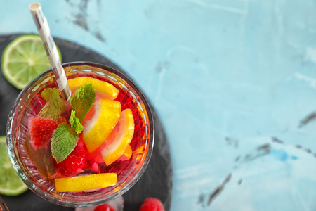 Glass of fresh raspberry mojito on  table, top viewの写真素材