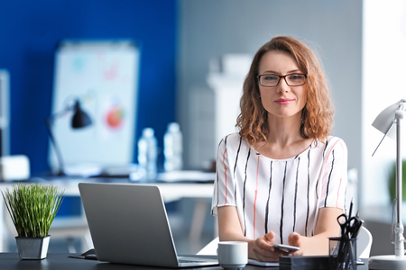 Successful businesswoman working in officeの写真素材