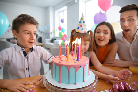 Happy family celebrating birthday at party
