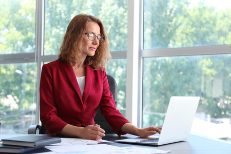Successful businesswoman working in officeの写真素材