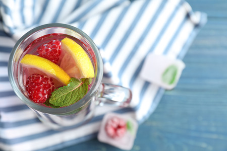 Glass of fresh raspberry mojito on  table, top viewの写真素材