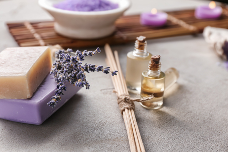 Soap, lavender and essential oil for spa on tableの写真素材