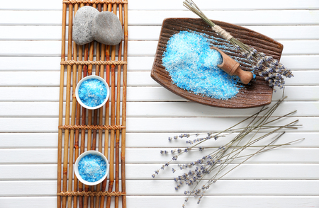 Spa composition with sea salt and lavender on wooden tableの写真素材