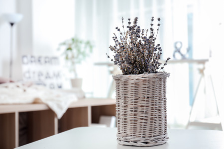 Vase with beautiful lavender flowers on tableの写真素材