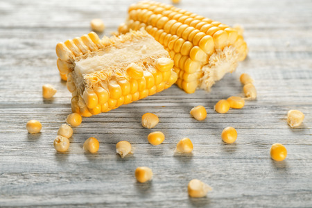 Fresh cut corn cob on wooden table