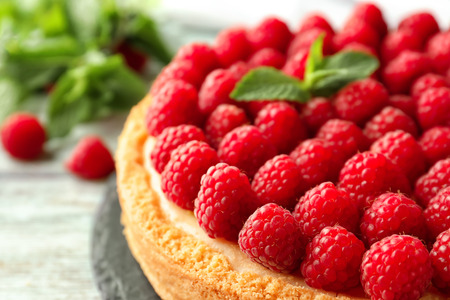 Delicious cheesecake with raspberries on plate, closeupの写真素材