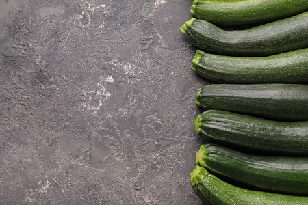 Ripe zucchinis on grunge tableの写真素材