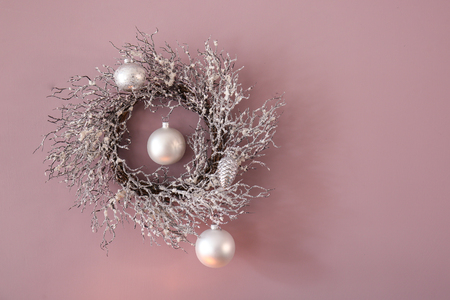 Christmas wreath with balls on color backgroundの写真素材