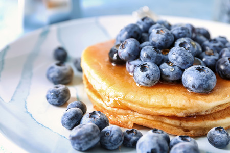 Tasty pancakes with blueberries on plate, closeupの写真素材