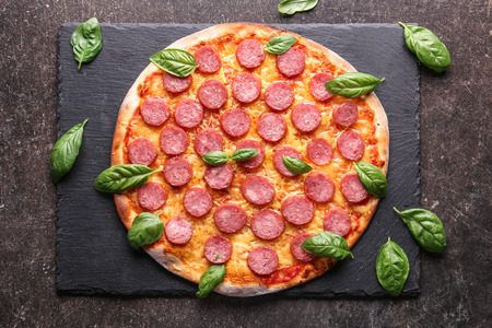 Tasty Pepperoni pizza on dark backgroundの写真素材