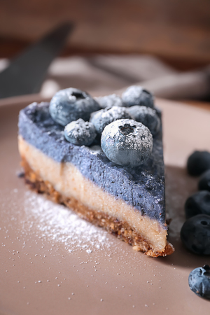 Delicious blueberry cheesecake on plate, closeupの写真素材