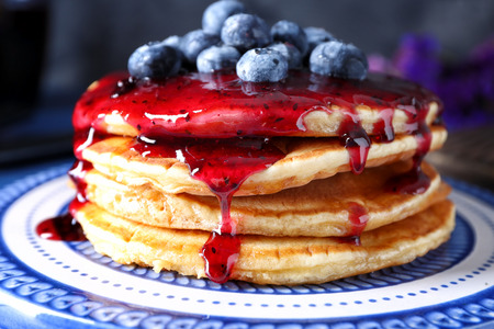 Plate with tasty pancakes, jam and blueberries, closeupの写真素材