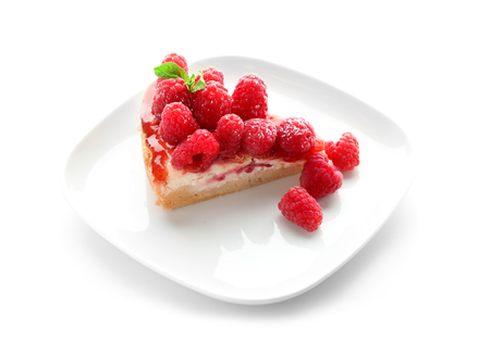 Plate with piece of delicious raspberry cheesecake on white backgroundの写真素材