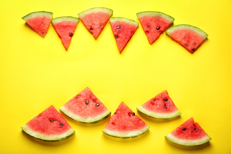 Delicious sliced watermelon on color backgroundの写真素材