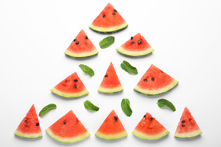 Composition with delicious sliced watermelon on white backgroundの写真素材