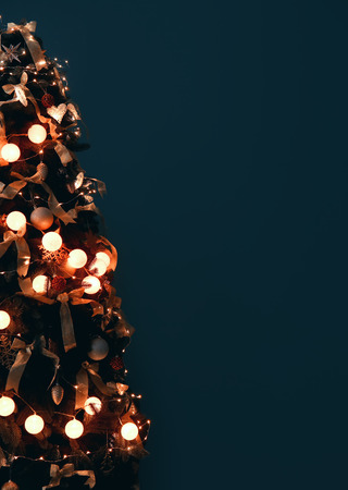 Beautiful decorated Christmas tree on dark color backgroundの写真素材