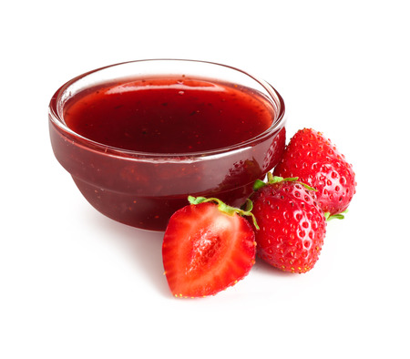 Bowl with delicious strawberry jam on white backgroundの写真素材