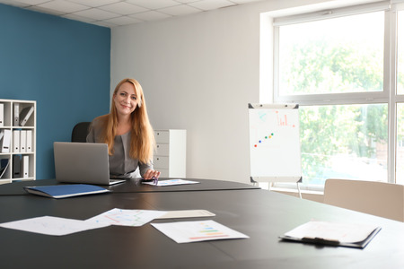 Stylish businesswoman working in office