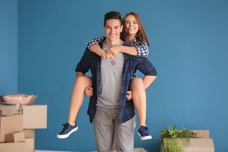 Happy young couple after moving to new houseの写真素材