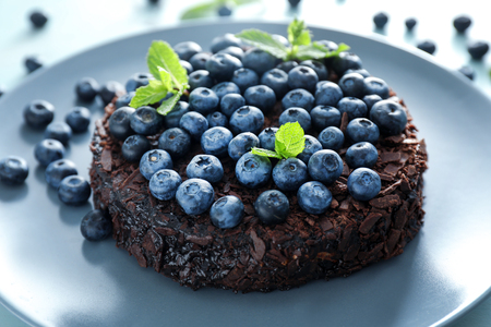 Delicious blueberry chocolate cake on plate, closeupの写真素材