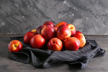 Fresh peaches on dark tableの写真素材