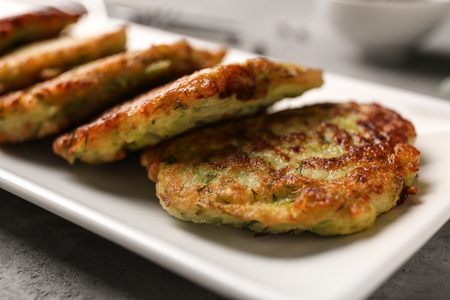 Plate with zucchini pancakes, closeupの写真素材