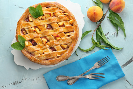 Tasty homemade peach pie on tableの写真素材