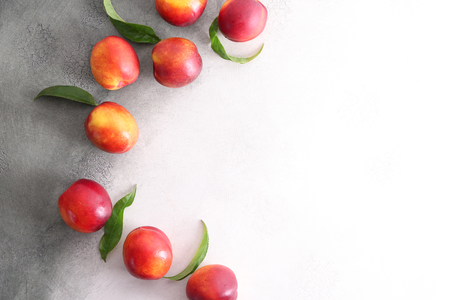 Fresh sweet peaches on light backgroundの写真素材