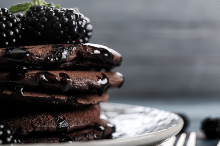 Tasty chocolate pancakes on plate, closeupの写真素材