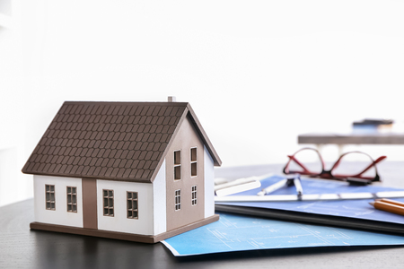 House model with drawings on table. Mortgage conceptの写真素材
