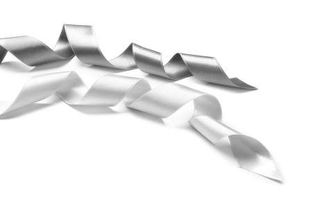 Silver ribbons on white backgroundの写真素材