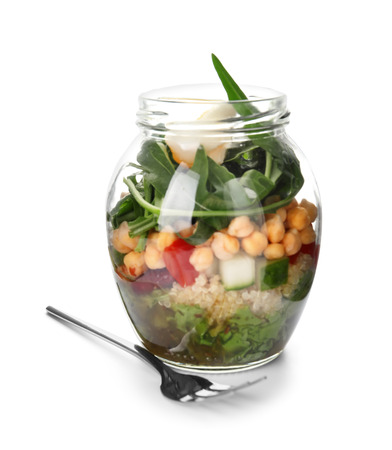 Delicious vegetable salad in mason jar on white backgroundの写真素材