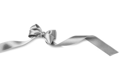 Silver ribbon with bow on white backgroundの写真素材