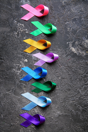 Different colorful ribbons on grunge background. Cancer conceptの写真素材