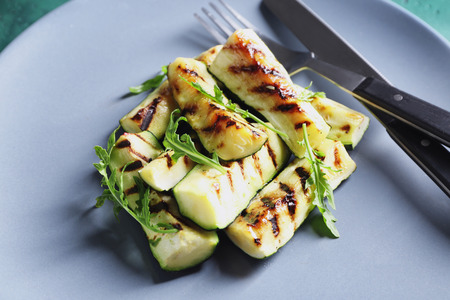 Tasty grilled zucchini on plate, closeupの写真素材