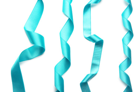Turquoise ribbons on white backgroundの写真素材