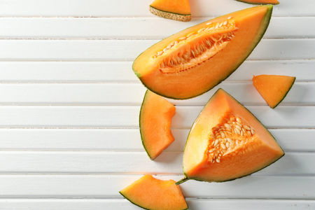 Tasty cut melon on wooden tableの写真素材
