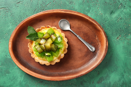 Delicious tart with fruits on plateの写真素材