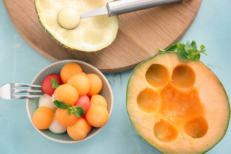 Composition with tasty melon balls on tableの写真素材