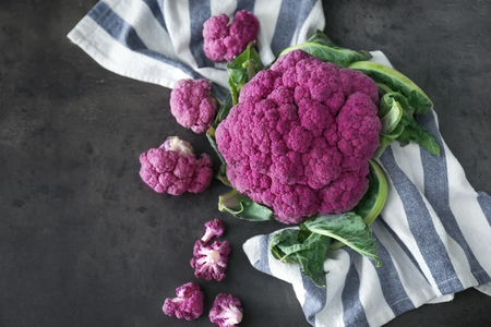 Purple cauliflower cabbage on grey tableの写真素材