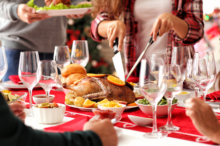 Happy family having Christmas dinner at homeの写真素材