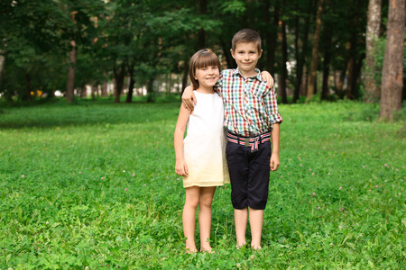 Cute little children in park on summer dayの写真素材