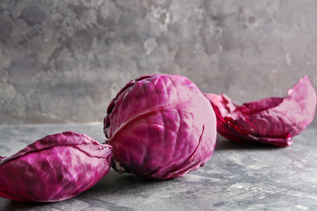 Ripe red cabbage on grey tableの写真素材